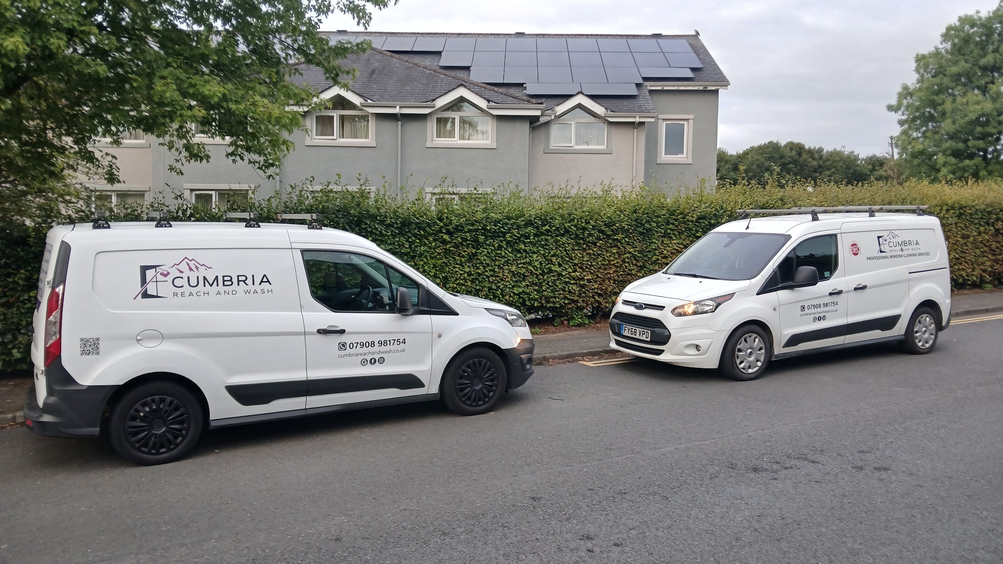 Two branded vans, the Cumbria Reach and Wash fleet